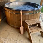 Pádlo pro mícháni vody v koupacím sudu